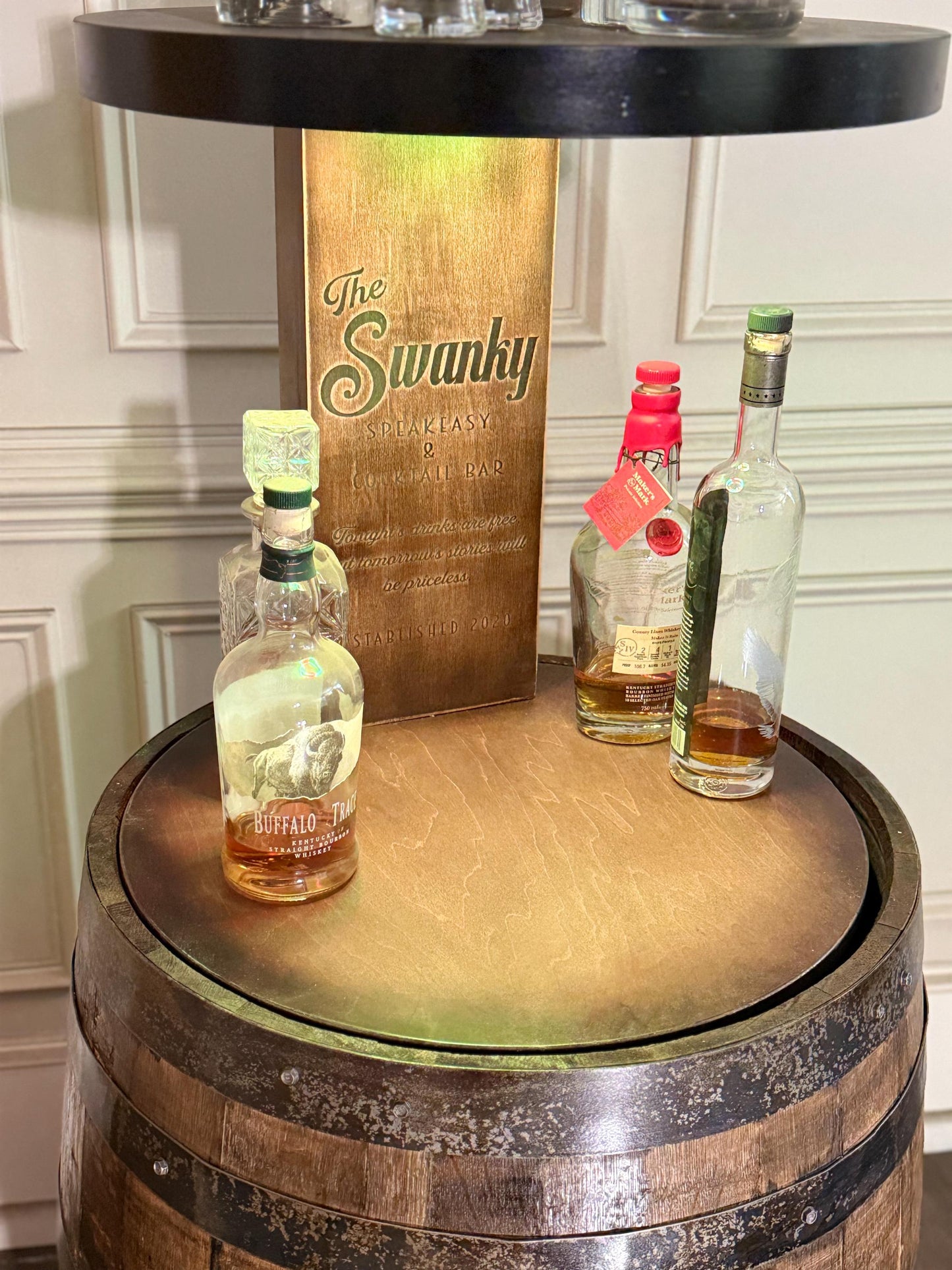 Motorized Pop Up Bourbon Barrel Cabinet.  Remote control & LED lighting.  Works with Alexa and Google Home. Custom engraving available.