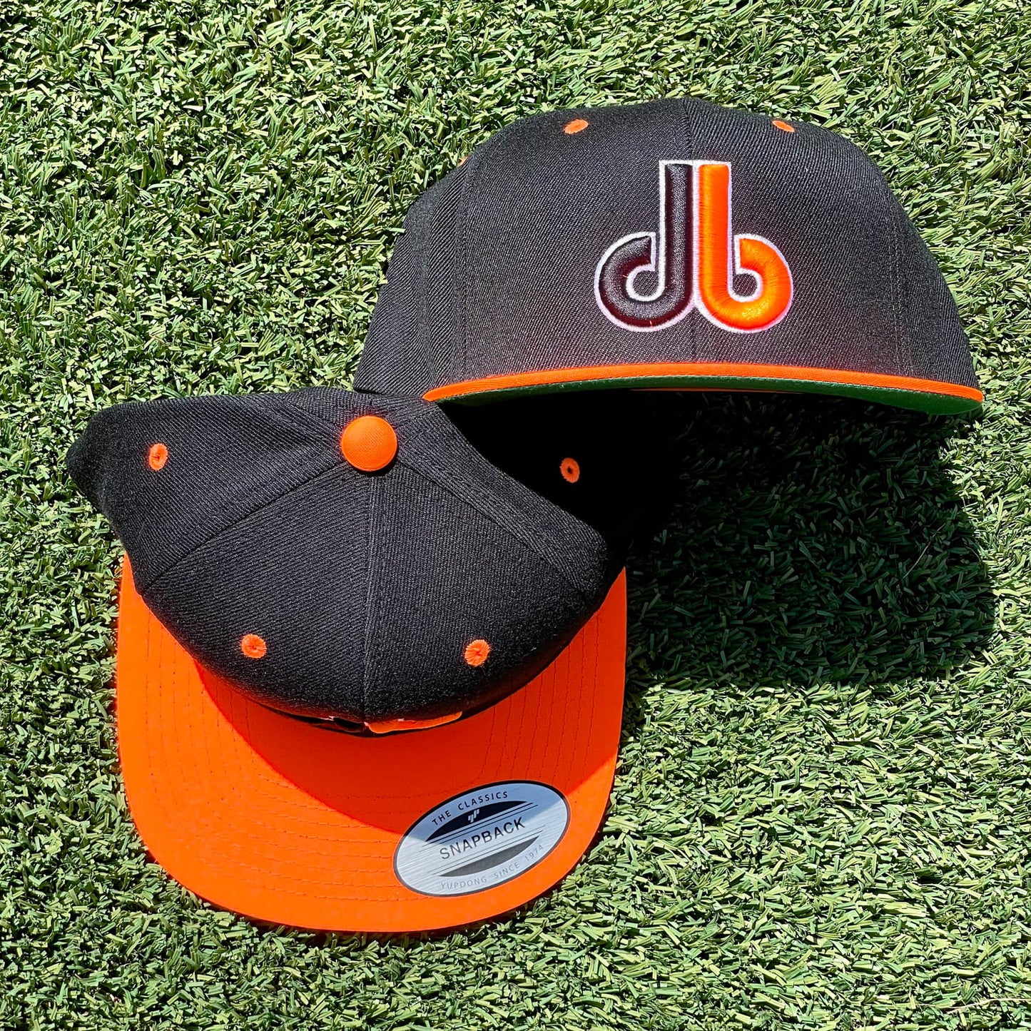db hat - Two Tone - Black and Orange